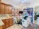 Bright bonus room with floral accent wall, custom cabinets, and lots of natural light at 484 Villa Park Rd, Kissimmee, FL 34759