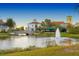 Beautiful community with waterfront views, fountain, and a bridge on a sunny day at 484 Villa Park Rd, Kissimmee, FL 34759