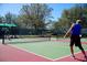 Outdoor pickleball courts surrounded by trees, providing a fun and active lifestyle at 484 Villa Park Rd, Kissimmee, FL 34759