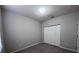 This bedroom features a double door closet and neutral walls and carpet at 501 Terrace Ridge Cir # 501, Davenport, FL 33896