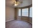 Neutral-toned bedroom with carpeted floors, bay window and ceiling fan at 501 Terrace Ridge Cir # 501, Davenport, FL 33896