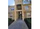 Condo building entrance with stairway to upper units at 501 Terrace Ridge Cir # 501, Davenport, FL 33896