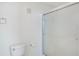 A toilet and glass enclosed shower in a brightly lit bathroom at 5025 Wellington Park Cir # 68, Orlando, FL 32839