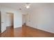 Wood-look flooring featured in a bedroom with doors to a closet and hallway at 5025 Wellington Park Cir # 68, Orlando, FL 32839