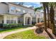 Exterior shot of a townhome showcasing landscaping, an inviting entrance, and architectural details at 5025 Wellington Park Cir # 68, Orlando, FL 32839