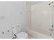 Bathroom featuring a toilet, bathtub and shower with white tiling at 5560 Metrowest Blvd # 304, Orlando, FL 32811