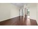 Spacious bedroom with wood floors and a mirrored closet at 5560 Metrowest Blvd # 304, Orlando, FL 32811