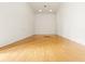 Clean and well-lit indoor racquetball court with hardwood floors and white walls at 5560 Metrowest Blvd # 304, Orlando, FL 32811