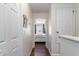 Hallway view leading to a bedroom with hardwood flooring at 565 Cresting Oak Cir # 87, Orlando, FL 32824