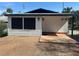 Backyard includes a wooden deck with geometric tiling and exterior lighting at 610 Illinois Ave, St Cloud, FL 34769