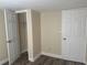 Bedroom with closet, and door on brown laminate floor at 610 Illinois Ave, St Cloud, FL 34769