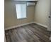 Bedroom with laminate floor, light walls, and window at 610 Illinois Ave, St Cloud, FL 34769