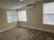 This bedroom has a mini-split AC unit and two windows for natural light at 610 Illinois Ave, St Cloud, FL 34769