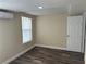 Interior view of the bedroom showcasing flooring and the mini split AC unit at 610 Illinois Ave, St Cloud, FL 34769