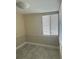 A cozy bedroom featuring wainscoting and a window at 610 Illinois Ave, St Cloud, FL 34769