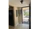 A clean entrance area with tile flooring and view to the exterior at 610 Illinois Ave, St Cloud, FL 34769