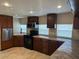 A bright kitchen featuring modern appliances and stylish cabinetry at 610 Illinois Ave, St Cloud, FL 34769