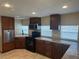 A well-lit kitchen with modern appliances and light tile floors at 610 Illinois Ave, St Cloud, FL 34769