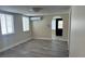 Bright living room with laminate floors, air conditioner and archway entrance at 610 Illinois Ave, St Cloud, FL 34769