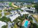 Aerial view of residential community with swimming pool near golf course and vacant lots at 7503 Mourning Dove Cir # 301, Reunion, FL 34747