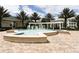 Outdoor fountain with ornate pergola, hardscape and lush landscaping at 7503 Mourning Dove Cir # 301, Reunion, FL 34747