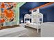 Playful ' bedroom with custom wall art and bunk beds at 7622 Oakmoss Loop, Davenport, FL 33837