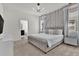 Main bedroom with modern lighting, neutral color palette, and stylish decor at 7622 Oakmoss Loop, Davenport, FL 33837