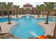 Large community swimming pool featuring a water slide and a fountain at 7622 Oakmoss Loop, Davenport, FL 33837