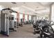 Bright and spacious gym equipped with various weight machines and exercise equipment at 7622 Oakmoss Loop, Davenport, FL 33837