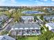 Aerial view of townhomes with private screened-in patios, lush landscaping, and access to community amenities at 7682 Fitzclarence St, Kissimmee, FL 34747