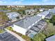 Aerial view of community featuring residential buildings with screened lanais and a swimming pool at 7682 Fitzclarence St, Kissimmee, FL 34747