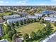 Beautiful aerial shot of townhomes surrounding a central green space, perfect for families and outdoor activities at 7682 Fitzclarence St, Kissimmee, FL 34747