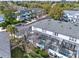 Aerial view of a community featuring residential buildings with screened lanais and well-kept landscaping at 7682 Fitzclarence St, Kissimmee, FL 34747