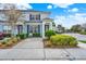 Charming two-story townhome with blue shutters and well-maintained landscaping at 7682 Fitzclarence St, Kissimmee, FL 34747