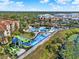 A panoramic aerial view of the community waterpark featuring slides, pools, and a splash pad at 7682 Fitzclarence St, Kissimmee, FL 34747