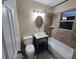 Bathroom featuring a shower and tub combo with brown tile and a modern vessel sink at 7709 Bell Blvd, Orlando, FL 32810