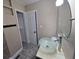 Bathroom with light beige walls, a modern vessel sink, and a door leading to a closet at 7709 Bell Blvd, Orlando, FL 32810