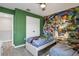 Bedroom showcasing cartoon character wall art and two single beds at 7761 Tosteth St, Kissimmee, FL 34747