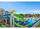 Community waterpark featuring colorful water slides, splash pad, and sun loungers for Gathering fun at 7761 Tosteth St, Kissimmee, FL 34747