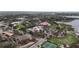 Aerial view showcasing the property, the surrounding neighborhood and nearby lake at 802 S 10Th St, Haines City, FL 33844