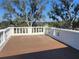 Exterior view of an expansive deck with decorative white columns at 802 S 10Th St, Haines City, FL 33844