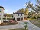 A detached garage apartment features a two-car garage, living space and balcony at 802 S 10Th St, Haines City, FL 33844