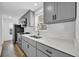 Updated kitchen featuring shaker cabinets, stainless steel appliances, quartz countertops, and subway tile backsplash at 802 S 10Th St, Haines City, FL 33844