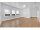 Bright living room featuring hardwood floors, white walls, and large windows with natural light at 802 S 10Th St, Haines City, FL 33844