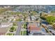 Wide aerial view of a residential community featuring colorful single-Gathering homes and well-maintained streets at 8103 Yellow Crane Dr, Kissimmee, FL 34747