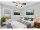 Bedroom is virtually staged with a bed, side tables, and backyard views at 8103 Yellow Crane Dr, Kissimmee, FL 34747