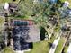 Aerial view of the home showing pool, roof, and back yard at 830 E Flag Ln, Kissimmee, FL 34759