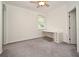 Neutral bedroom with gray carpet, natural light and a built-in desk at 8766 The Esplanade # 23, Orlando, FL 32836