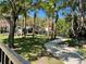 Community park with playground, benches, walkway, and many trees at 8766 The Esplanade # 23, Orlando, FL 32836