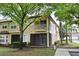 Charming condo featuring a second-story balcony, screened lanai, and lush landscaping in a desirable community at 8766 The Esplanade # 23, Orlando, FL 32836